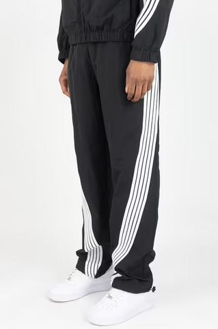 Rebel Minds 405 black crinkled nylon pants featuring white contrast side stripes and a relaxed fit