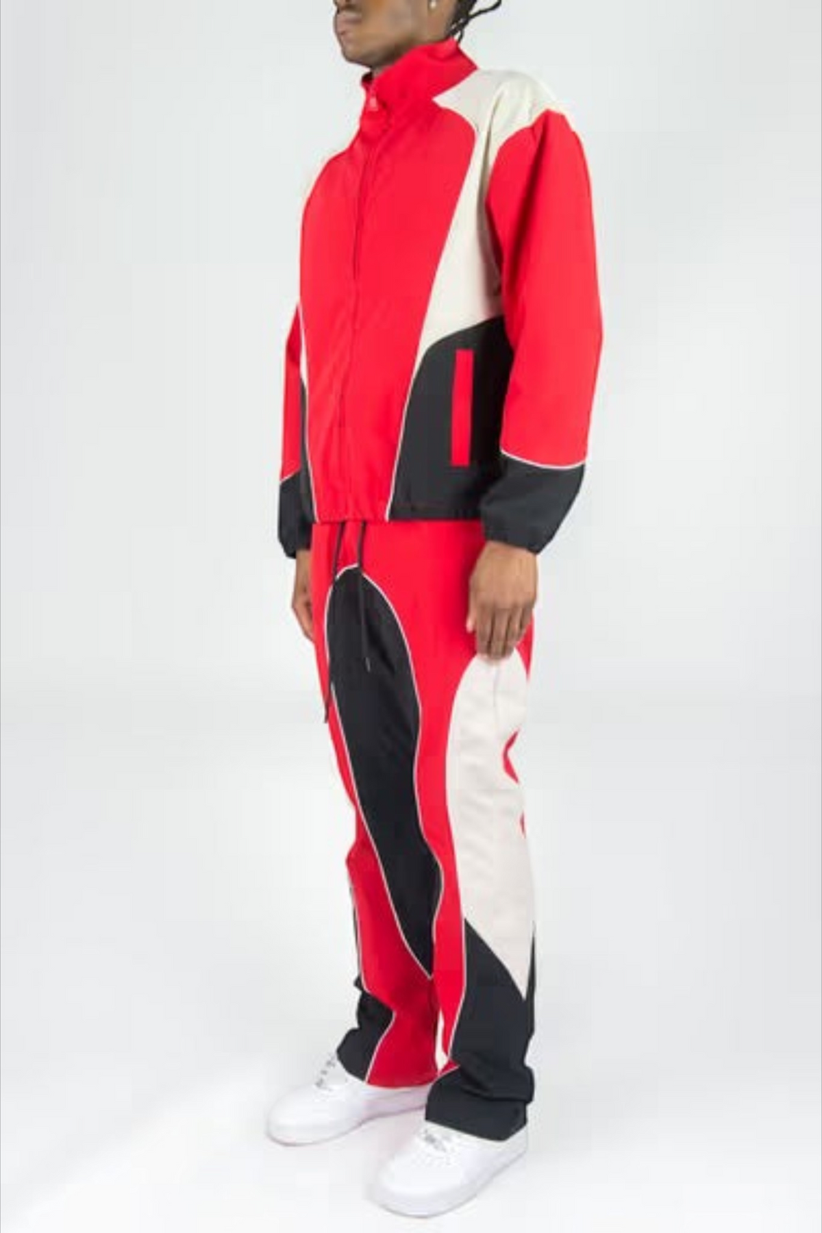 Rebel Minds red, white, and black color-blocked ripstop windbreaker jacket and flare-fit pants set on a model