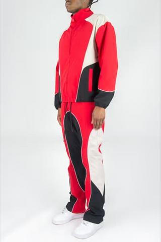 Rebel Minds red, white, and black color-blocked ripstop windbreaker jacket and flare-fit pants set on a model