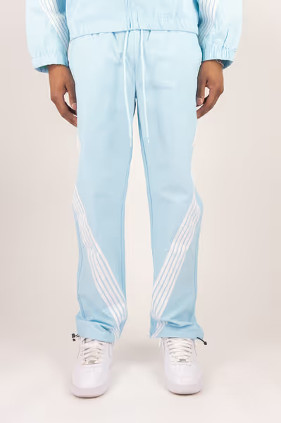Rebel Minds light blue crinkled nylon pants with white bent side stripes and adjustable drawstring cuffs
