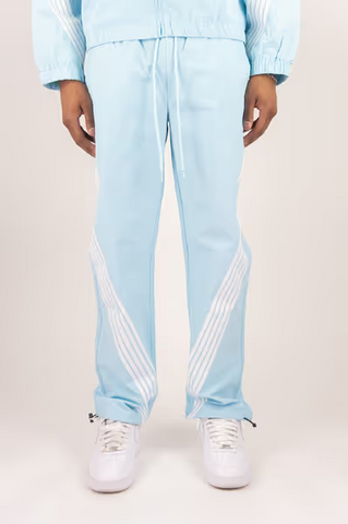 Rebel Minds light blue crinkled nylon pants with white bent side stripes and adjustable drawstring cuffs