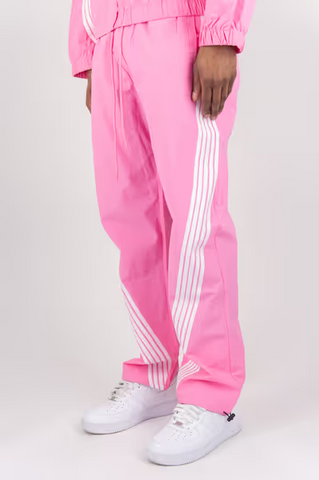 Rebel Minds pink crinkled nylon pants featuring white bent contrast stripes and an adjustable drawstring waist