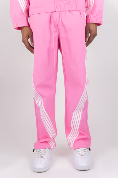 Rebel Minds pink crinkled nylon pants featuring white bent stripe detailing on the legs for a lightweight casual look