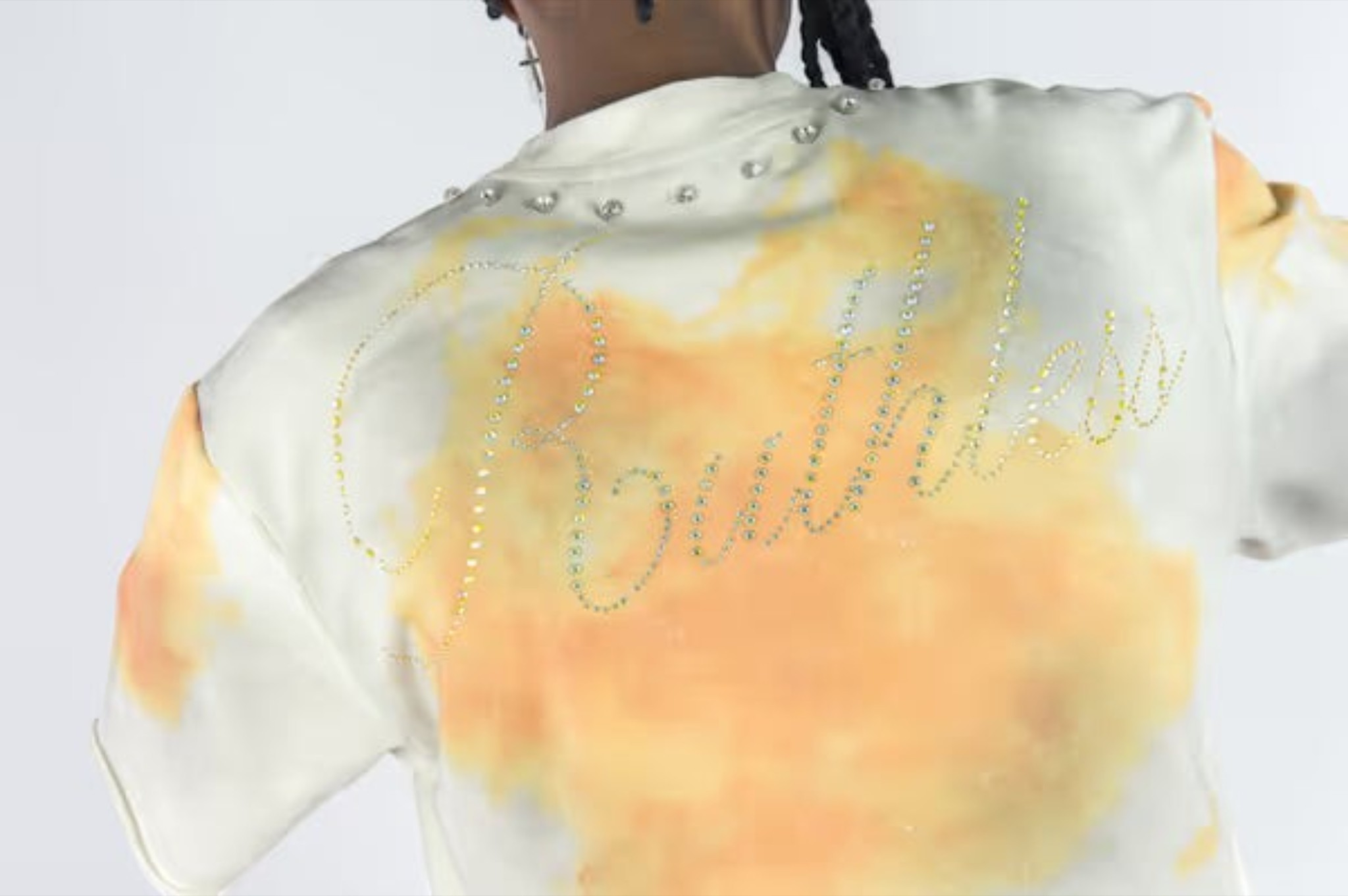 Rebel Minds cream and orange tie-dye cotton blend t-shirt with rhinestone Ruthless lettering and collar studs